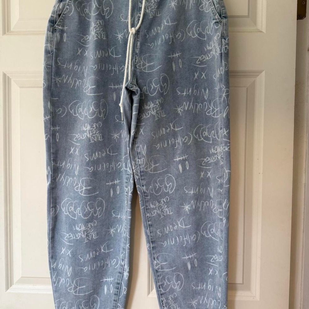 Gemma Rae Love Fire high-waisted denim jeans with‎ chalk art graffiti
